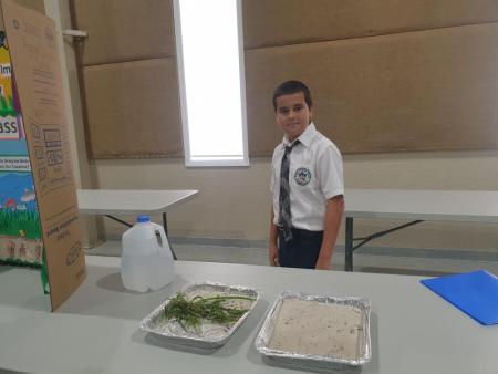 Sixth-grade student presents experiment at 2022 Friends of the Environment Science Fair.