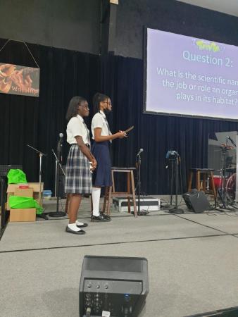 Two high school students participate in a trivia game at the 2022 Friends of the Environment Science Fair.