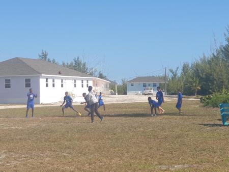 Several high school students play football at Camp Abaco during the 2022-2023 Spiritual Emphasis Week.