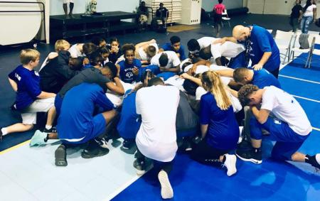 Senior Girls and Boys Pray Before Volleyball Game