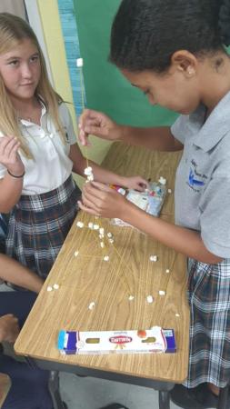 High school students participate in an in-class activity.