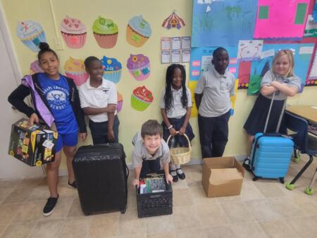 Fourth graders participate in "Bring Anything But a Bag to School" day.