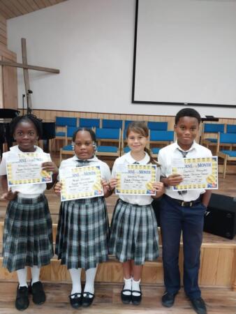 Students earn Student of the Month certificates.